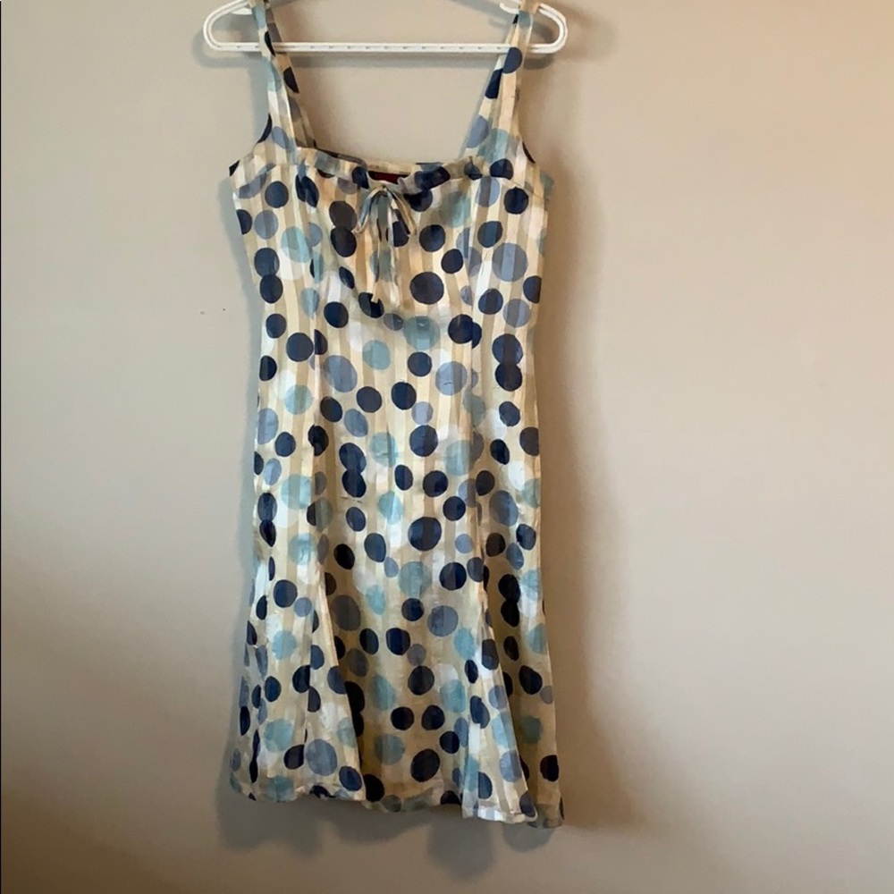 Blue and white cocktail dress with polka dots.
